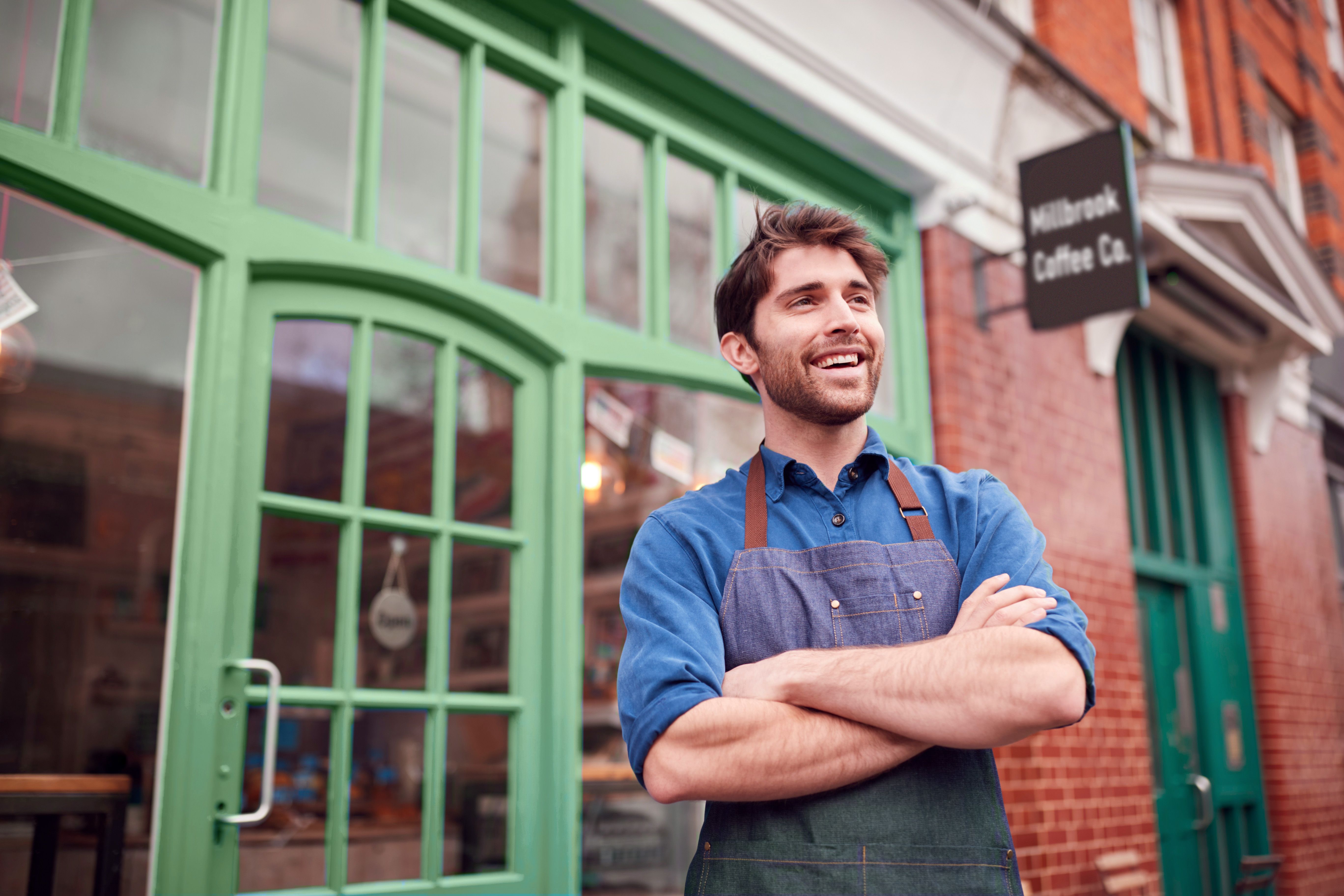 Green shopfront business owner