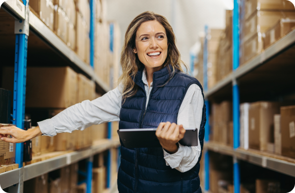 Image of female business owner in a warehouse succeeding with Millbrook's Business Finance Solutions